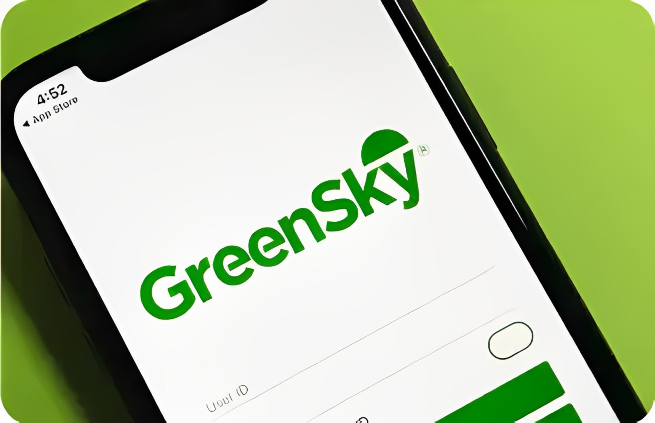 A smartphone screen showcases the GreenSky app with a login interface, highlighting seamless financing options and easy access to rebates.